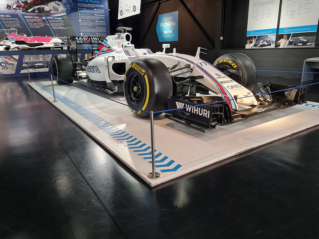 medium stanchions and bungee cord around a Formula 1 racecar at Haynes